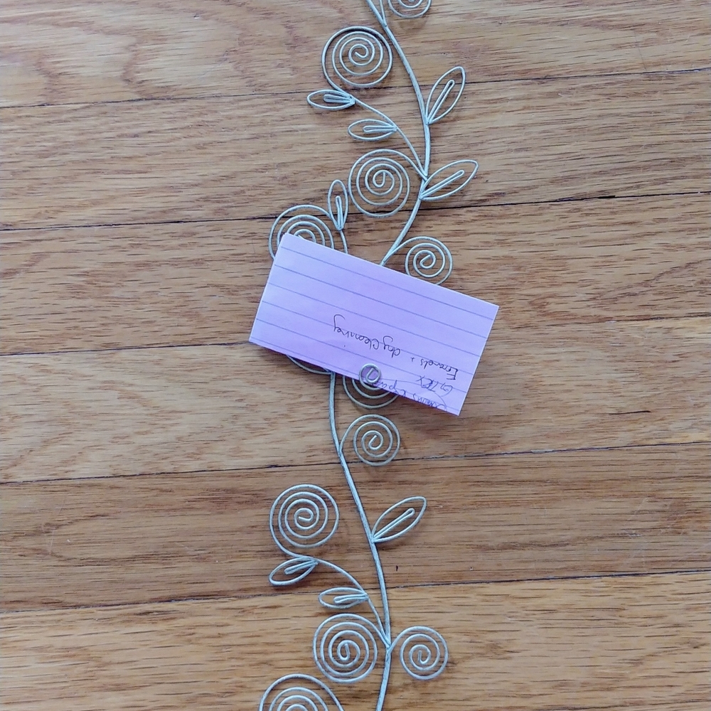 Scrolling wall art or photo holder